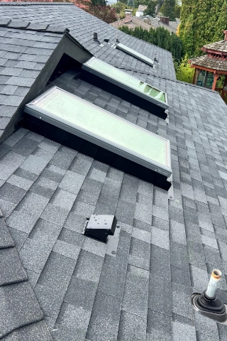 Completed multi layered architectural shingle roof replacement on a multi family residential structure in Sunnyside