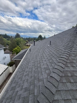 Precision GAF roof installation executing complex flashing and harness protocols on a steep-slope Brentwood Portland estate.
