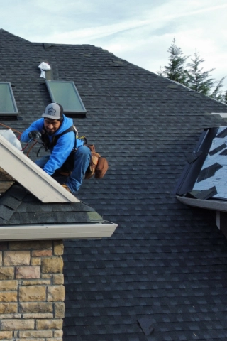 Certified GAF Master Elite roofers installing high performance Timberline HDZ shingles with a complete weather proof underlayment barrier