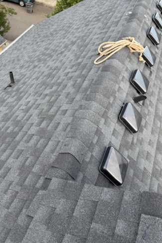 High performance GAF Timberline HDZ shingle upgrade on a finished residential roof field along the Oak Grove border