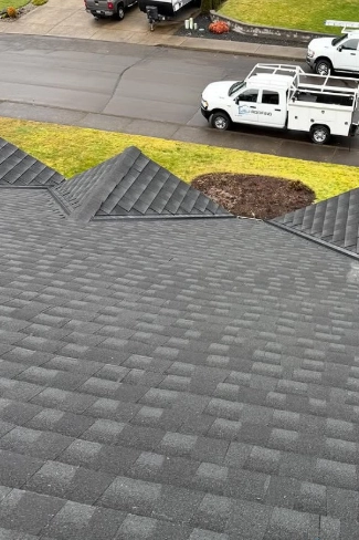 Clean moss free asphalt composite shingles after a preventative soft wash treatment on a home in the Hillendale neighborhood