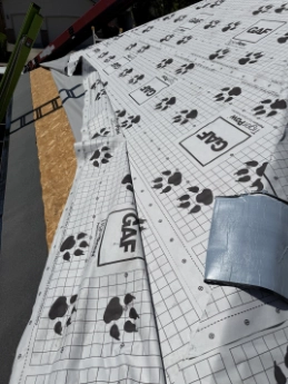 Advanced synthetic underlayment execution creating a monolithic moisture barrier on a Sellwood-Moreland bungalow restoration.