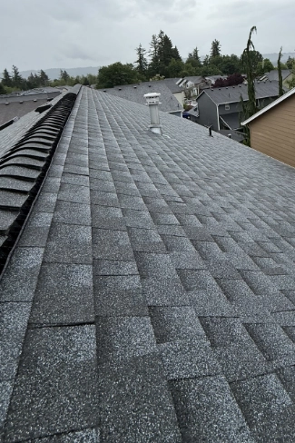 Completed layered architectural shingle roof replacement on a residential home in the McLoughlin district
