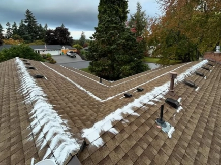 Roof cleaned and treated for moss by J&J Roofing & Construction